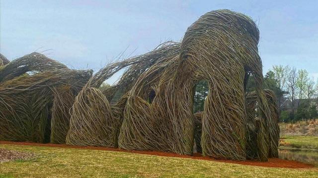 Patrick Dougherty, the 'Stick Wizard,' created a whimsical willow castle at Carpenter Park in Cary.