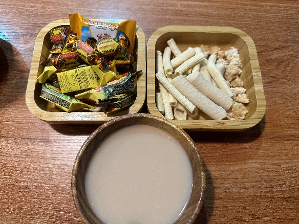 A picture containing indoor, meal

Description automatically generated