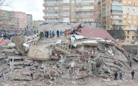 Rescue workers and volunteers conduct search and rescue operations in the rubble of a collapsed building, in Diyarbakir on February 6, 2023, after a 7.8-magnitude earthquake struck the country's south-east.  Picture: AFP