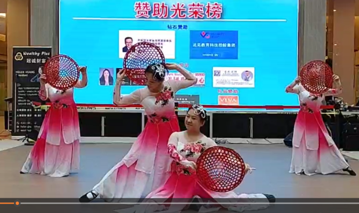 A group of women dancing on stageDescription automatically generated