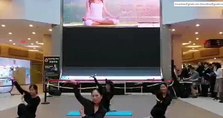 A group of women doing yogaDescription automatically generated