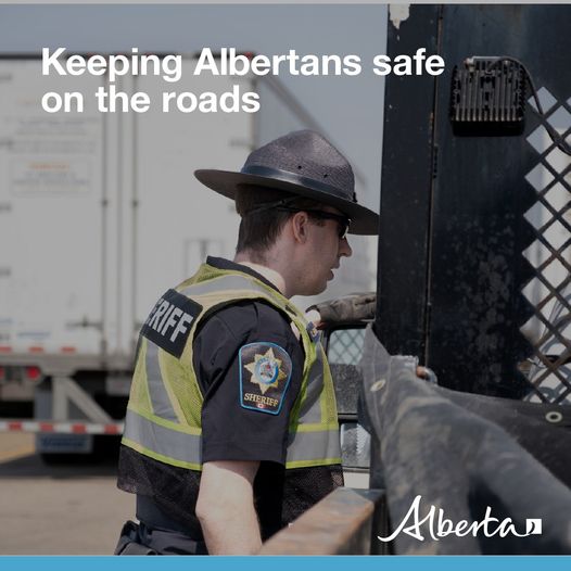 May be an image of 1 duine, road agus téacs a dheireann 'Keeping Albertans safe on the roads FRIFF SHERLEF መኛ SHERTE Albertan'