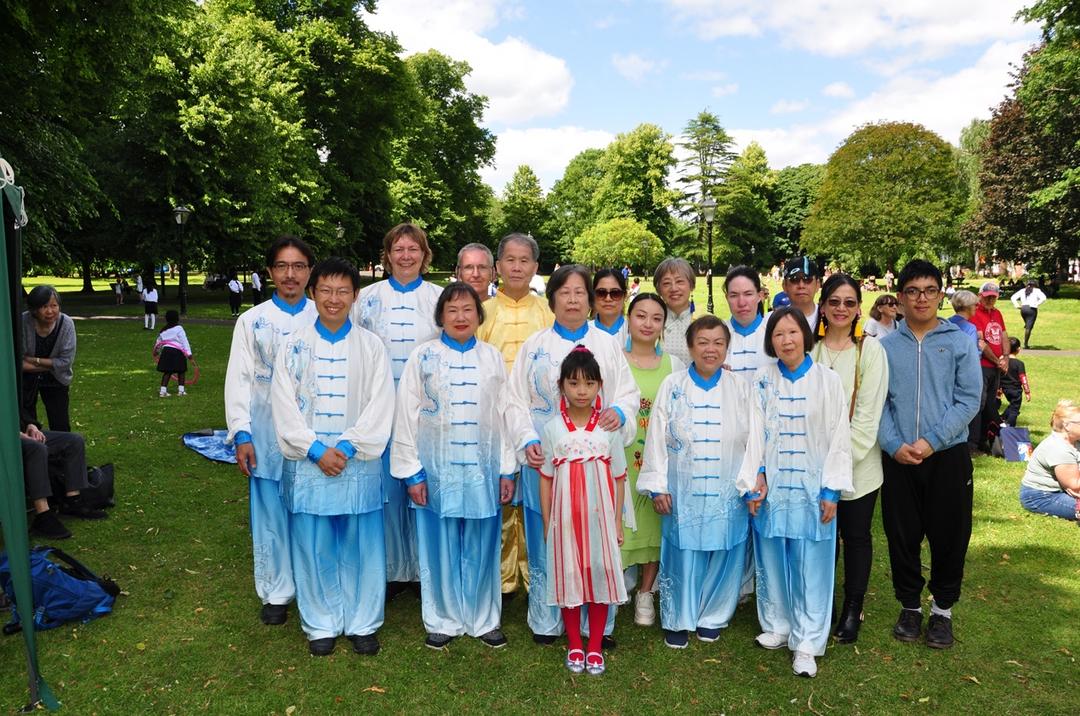 A group of people posing for a photo

Description automatically generated