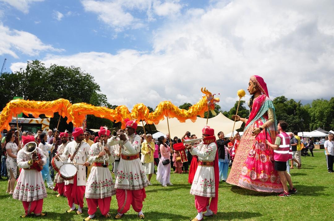 A group of people in traditional attire

Description automatically generated