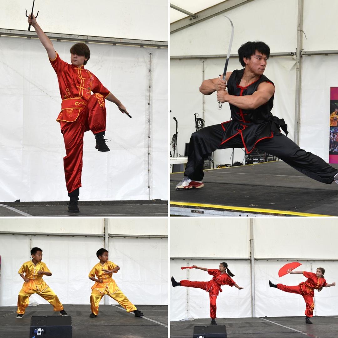 A group of people performing martial arts

Description automatically generated