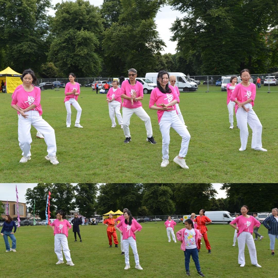 A group of people in pink shirts

Description automatically generated