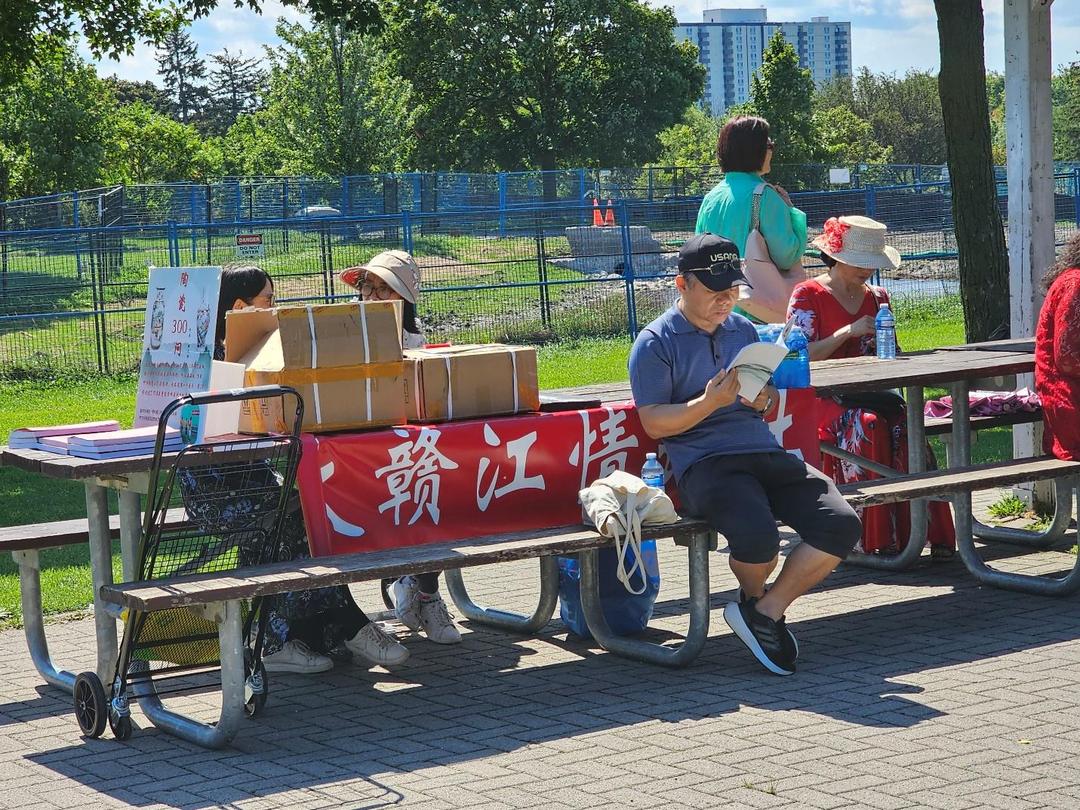 People sitting on a benchDescription automatically generated