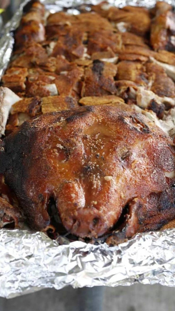 A close-up of a roasted pigDescription automatically generated