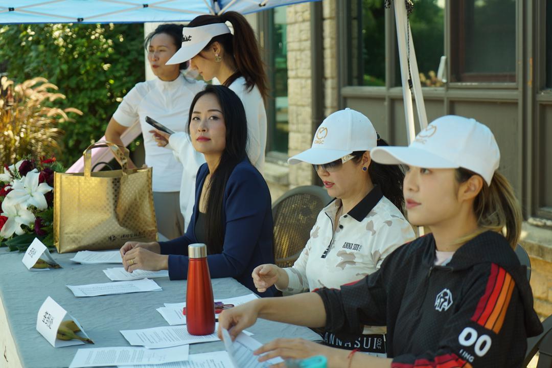 A group of women sitting at a tableDescription automatically generated