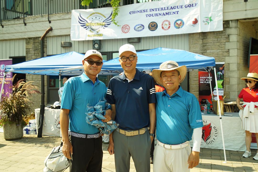 A group of men standing in front of a tentDescription automatically generated