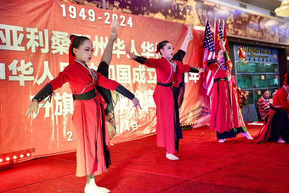 A group of girls dancing on a stage

Description automatically generated