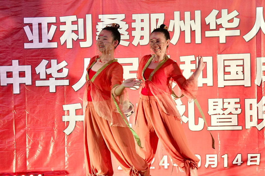 Two women dancing on a stage

Description automatically generated