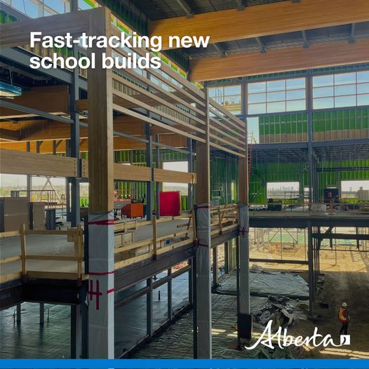 A building is under construction. The text reads fast-tracking new school builds. The white Alberta logo is in the bottom right hand corner.