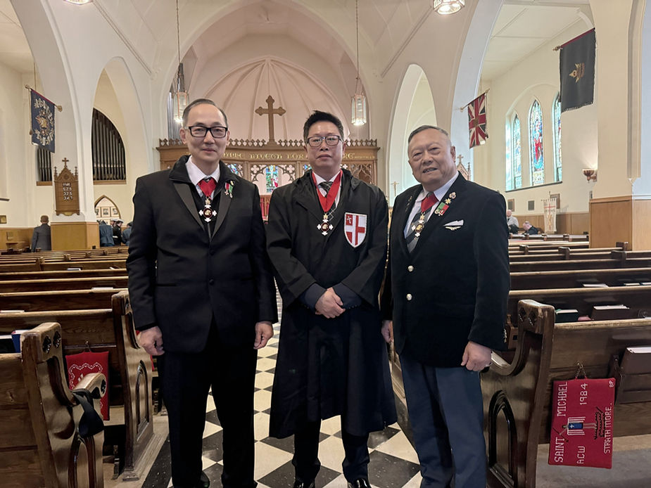 A group of men in suits in a church

Description automatically generated