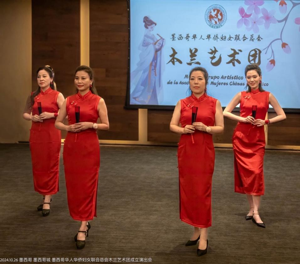 A group of women in red dresses

Description automatically generated