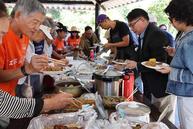 A group of people eating foodAI-generated content may be incorrect.