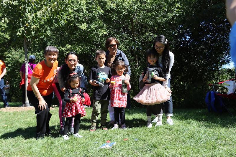 A group of people posing for a pictureAI-generated content may be incorrect.