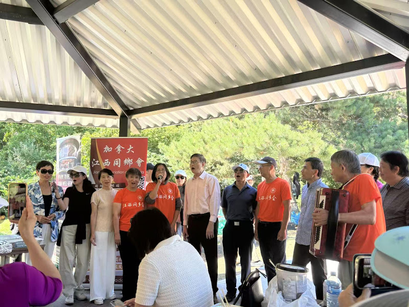 A group of people singing under a canopyAI-generated content may be incorrect.