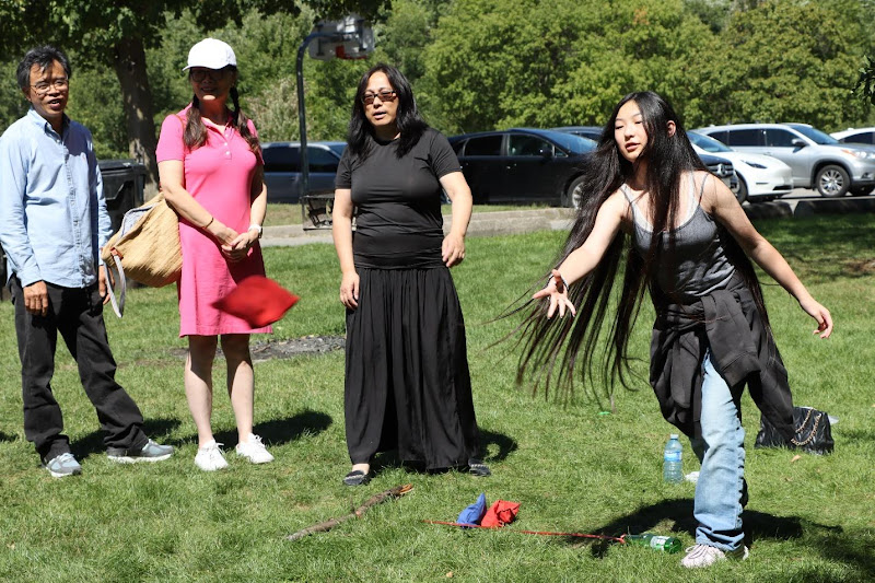 A group of people in a parkAI-generated content may be incorrect.