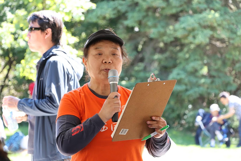 A person holding a microphone and clipboardAI-generated content may be incorrect.