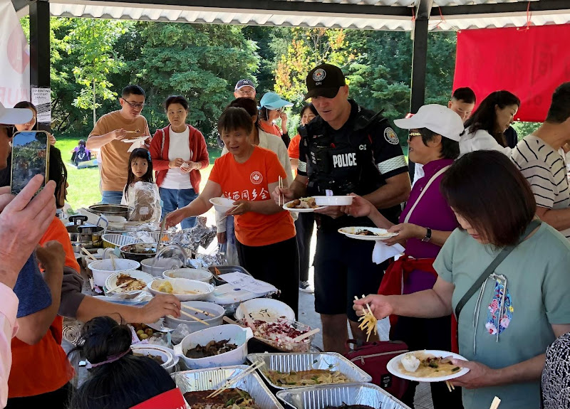 A group of people eating foodAI-generated content may be incorrect.