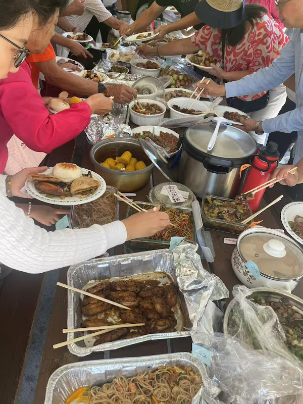 A group of people eating foodAI-generated content may be incorrect.