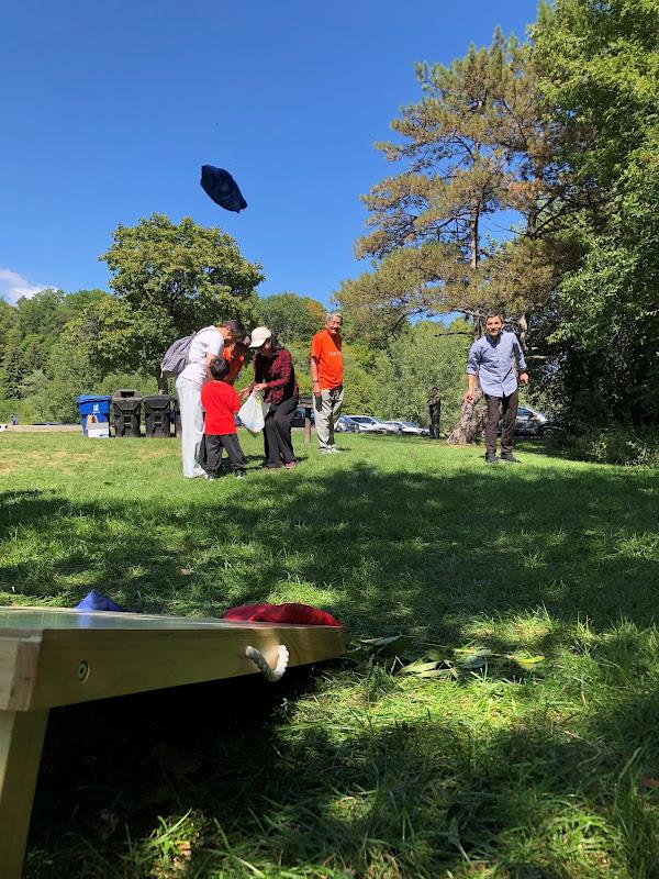 A group of people playing with a bagAI-generated content may be incorrect.