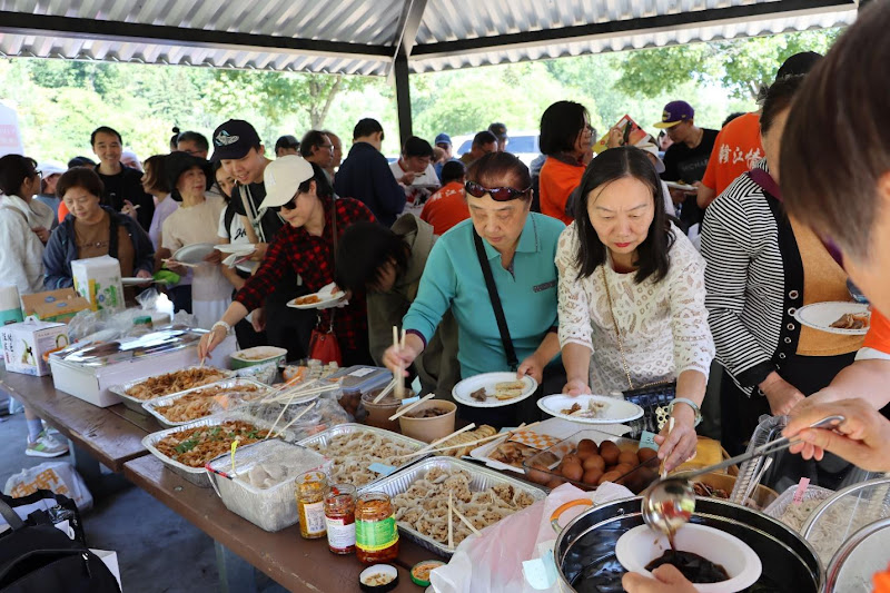 A group of people at a buffetAI-generated content may be incorrect.