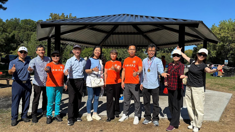 A group of people standing under a canopyAI-generated content may be incorrect.
