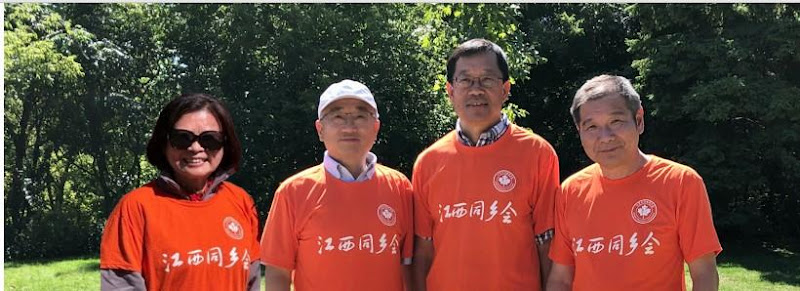 A group of men wearing matching orange shirtsAI-generated content may be incorrect.