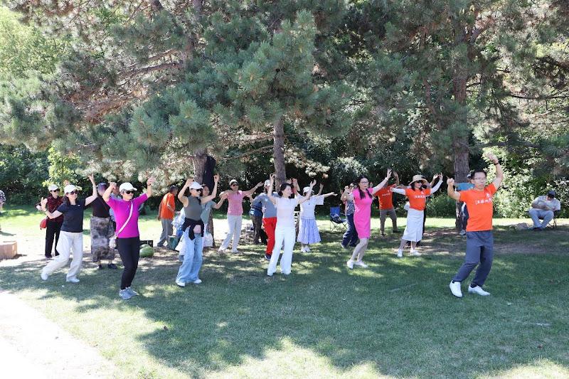 A group of people standing in a circleAI-generated content may be incorrect.