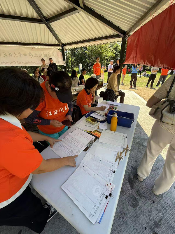 A group of people sitting at a tableAI-generated content may be incorrect.
