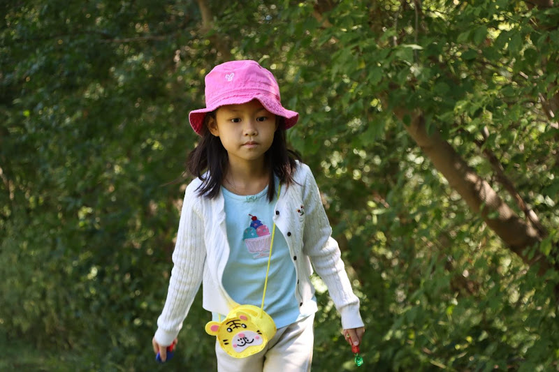 A child walking in a parkAI-generated content may be incorrect.