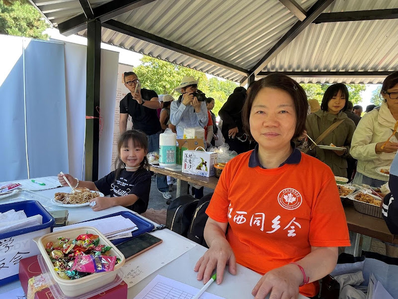 A person and child sitting at a tableAI-generated content may be incorrect.