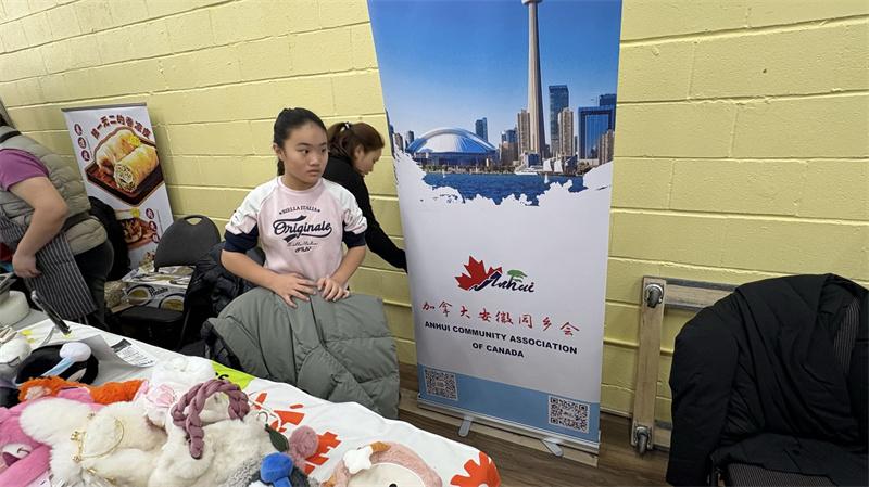 A child sitting in a room next to a poster AI-generated content may be incorrect.