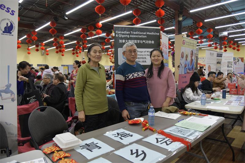 A group of people standing in a room AI-generated content may be incorrect.