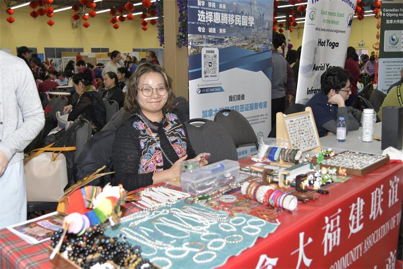 A person sitting at a table with jewelry AI-generated content may be incorrect.