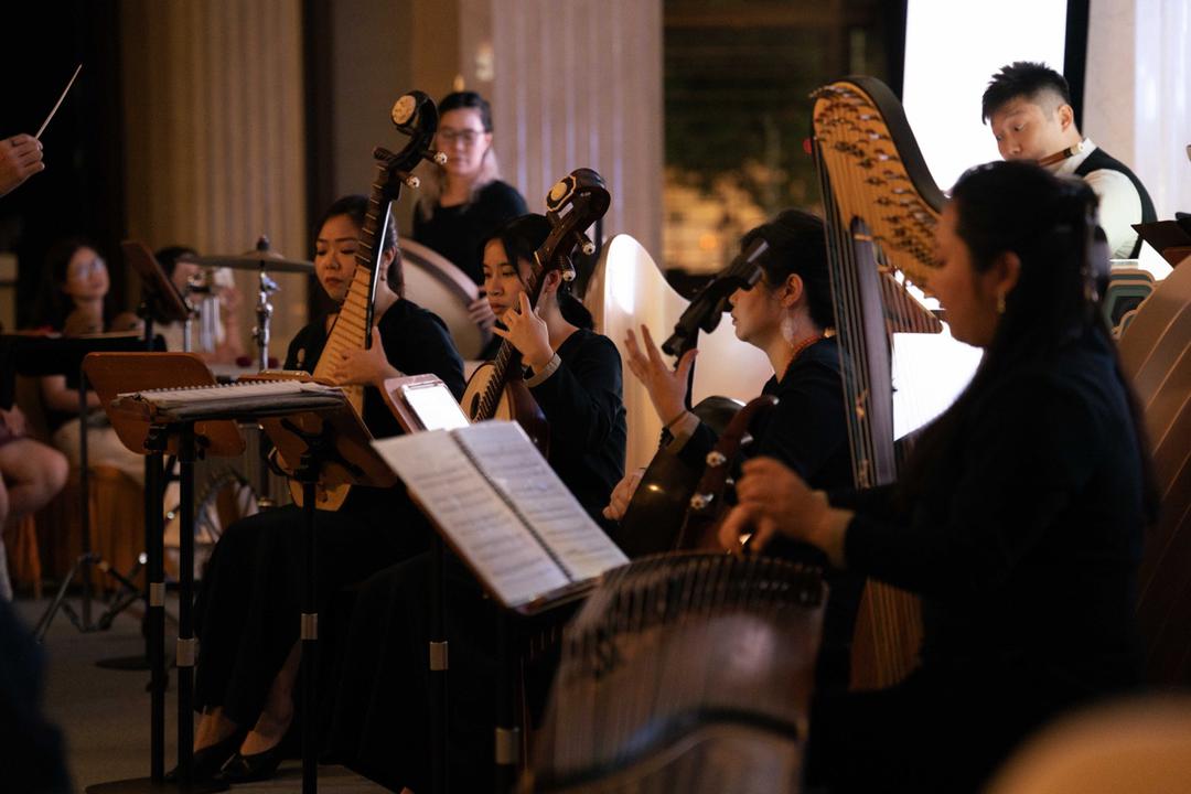 A group of people playing instrumentsAI-generated content may be incorrect.